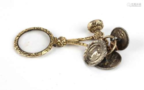 An attractive gilt decorated Monocle, with floral …