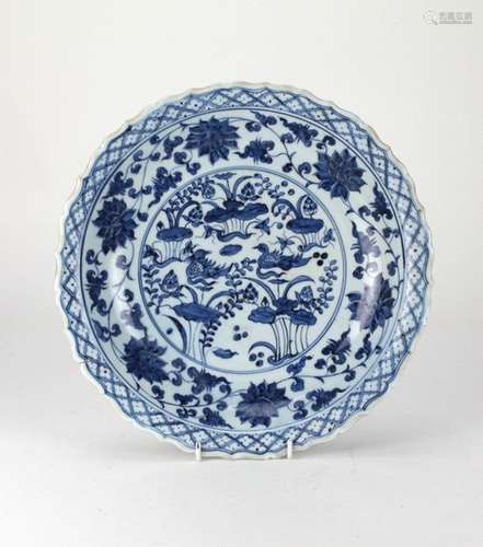 A rare Chinese blue and white floral barbed scroll…