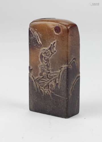 A tall Chinese carved soapstone Seal, with figure …