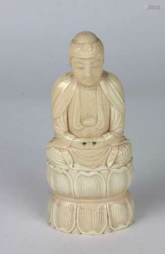 A well carved 19th Century ivory Buddha, seated on…