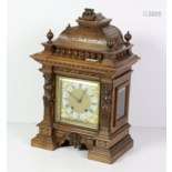 An Edwardian carved walnut Mantle Clock, the squar…