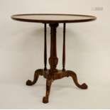 A George III style circular mahogany Table, with t…