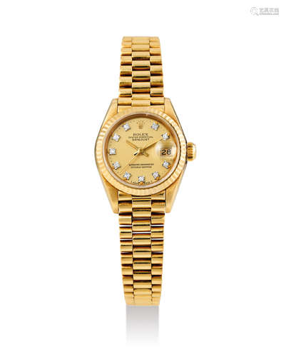 Rolex. A Lady's Yellow Gold Wristwatch with diamond indexes, Bracelet and Date