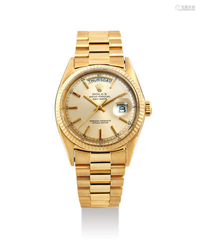 Rolex. A Yellow Gold Wristwatch with Day, Date and Bracelet