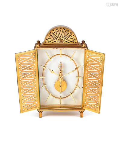 Swiss, In the manner of Jaeger-LeCoultre.  A Gilt Metal Decorative Mantel Timepiece