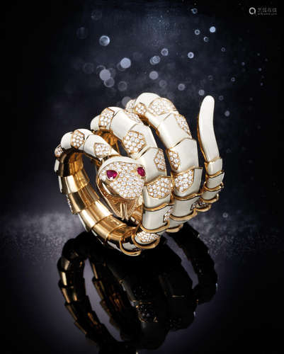 Bvlgari. An extremely rare yellow Gold, White Enamel, Ruby and Diamond-Set Serpent Bangle Watch, manufactured by Carlo Illario e Fratelli, Valenza Po