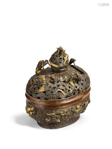 Xuande six-character mark, 18th century A fine parcel-gilt bronze 'dragon and phoenix' incense burner and cover