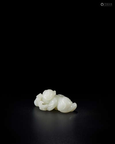 18th century A white jade carving of a recumbent boy holding a bird