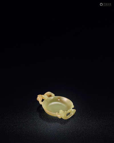 17th/18th century A fine and rare small yellow jade 'dragon' washer