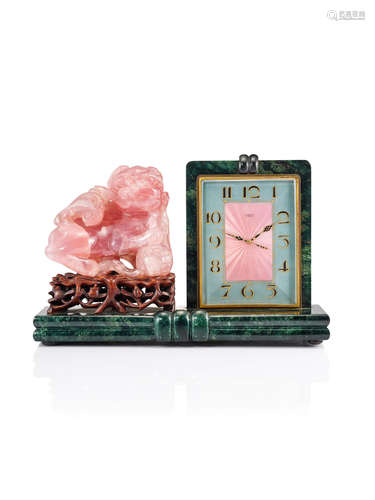 An Art Deco 'Dog of Fó' Rose Quartz, Marble, Enamel and Rosewood 'Chinoiserie' Table Clock, by Gubelin, Circa 1920