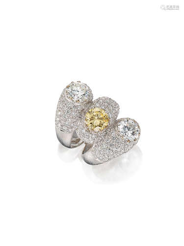 A Fancy Coloured Diamond and Diamond Three-stone Ring