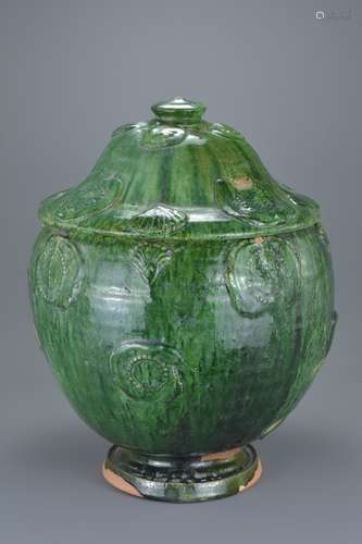 Large Chinese Song / Yuan Dynasty Glazed Buddhist Jar. The exterior coated in a dark green glaze, th