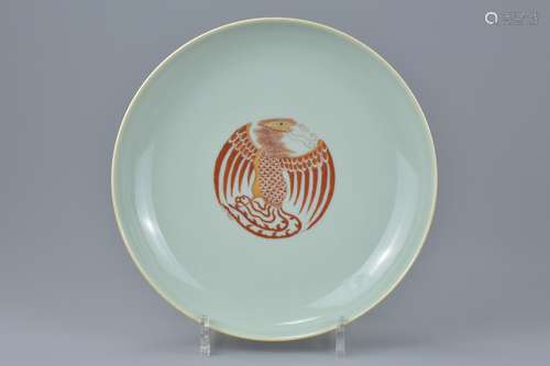 A Chinese celadon ground porcelain dish decorated with six iron-red phoenix . Six character mark of