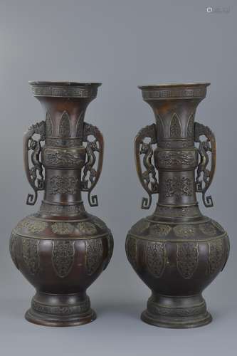 Pair of Large Japanese Bronze Vases, each with Twin Handles held by Mythical Creatures, Meiji Period