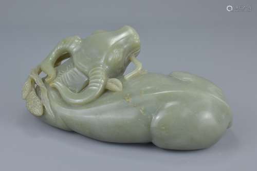 A Large Chinese Hetian Celadon Jade Carving of a Water Buffalo, 19th century or earlier, 24cms long