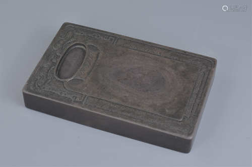 A heavy Chinese 'Duan' Stone Ink Stone / block with small well with carved dragon and floral pattern