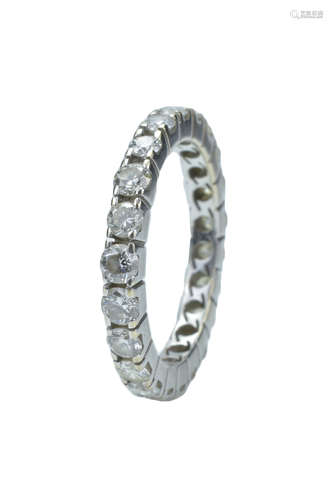 A white metal and diamond ring. Ring size M