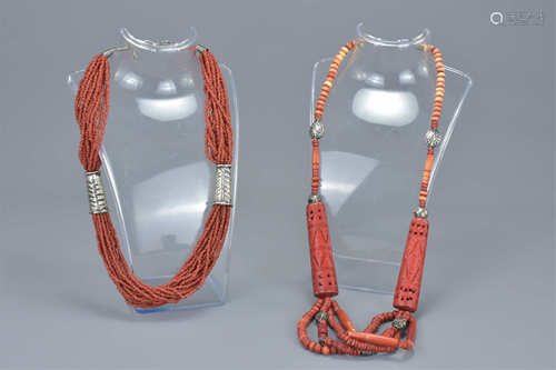 Two coral beaded necklaces with white metal spacers. (2)