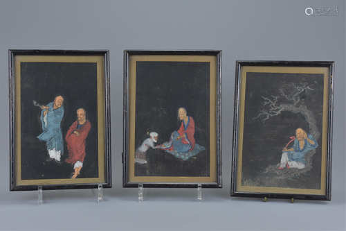 Three Chinese 19th century paintings framed and glazed on woven black material of Luohan under a tre