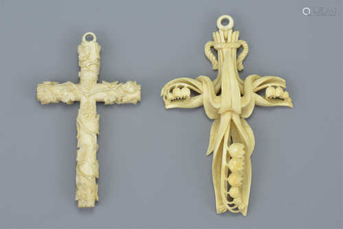 Two 19th century Ivory Crosses, one carved with Lily of the Valley, 9cms high and the other with ent