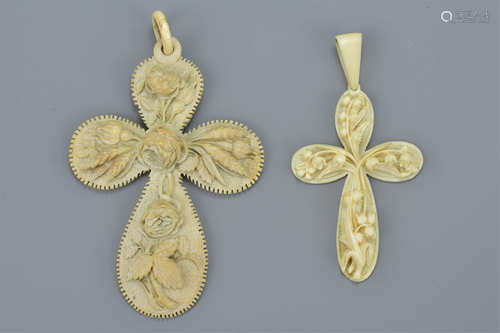 Two 19th century Ivory Crosses, one carved with Flowers, 10cms high and the other with Lily of the V