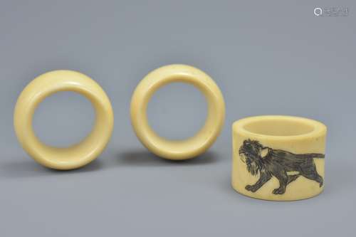 Three 19th century Ivory Napkin Rings, one with etched with a Lion (3)