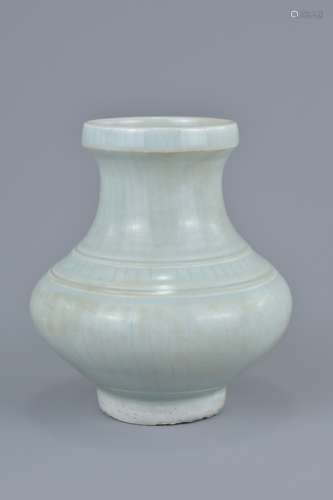 A Chinese 14th century Yuan dynasty Shufu type porcelain jar with lined decoration. 13cm tall