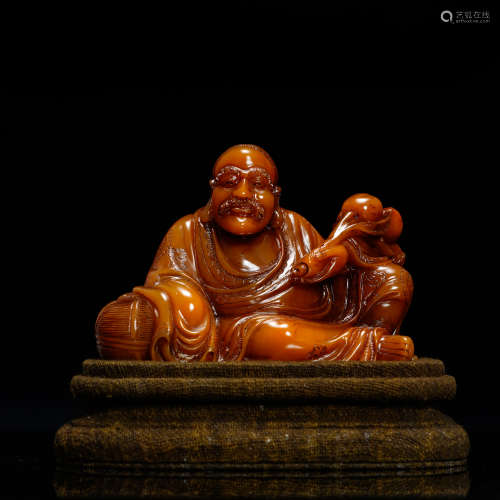 A Chinese Carved Tianhuang Figure of Buddha