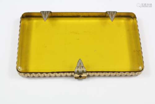 An Art Deco Amber-coloured Case, stamped Shields Incorporated, measuring approx 13 x 7 cms