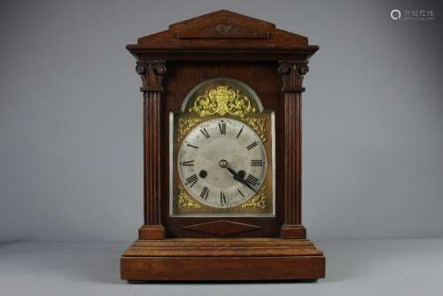 An Oak Cased Mantel Clock, brass and brushed steel face with Roman dial, approx 27 x 39 x 14 cms