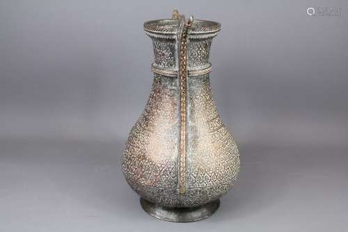 An 18th Century Deccani Ewer, with decorative handle and elongated spout, foliate engraving throughout, approx 31 cms h, cover missing