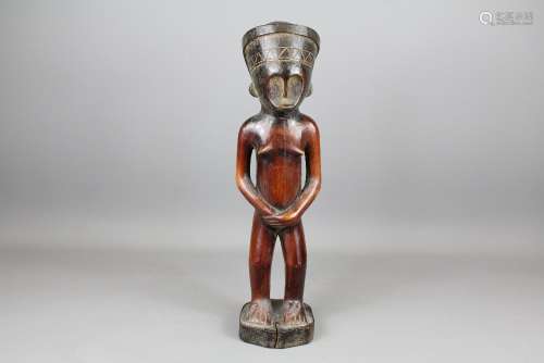 A Tabiva African Wood Carved Fertility Figure, depicted standing in a protective pose, approx 50cms h