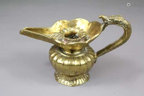 A Brass Nepalese Oil Vessel, with bulbous body, elongated spout and zoo-form handle, approx 18 x 9 cms