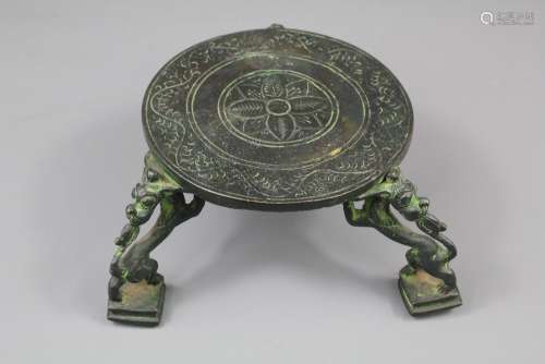 An Antique Indian Pot or Ewer Stand, supported by four mythological creatures, approx 9 x 13 cms