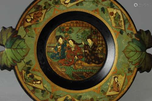 An 18th/19th Century Chinoiserie Dish; the Papier Mache dish depicting ladies grooming their hair and leaves to rim, approx 22 cms dia