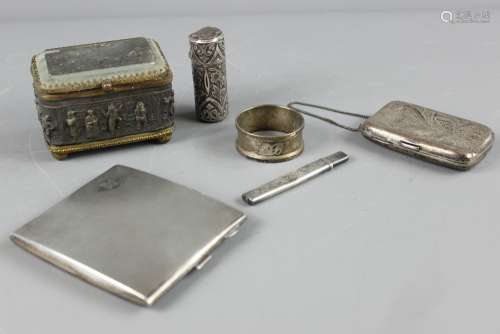 Miscellaneous Silver; including a cigarette case Birmingham hallmark, dated 1930, WM Ltd, engraved August 1932 in the lid, approx 10 x 9 cms, another silver cigarette case Birmingham hallmark, dated 1903 approx 8 x 5 cms, a napkin ring, needle case, Victorian scent bottle, Chester hallmark together with a bronze chest having a glass lid, depicting a tavern scene with figures in relief, on bun feet, approx 8 x 5 x 6 cms