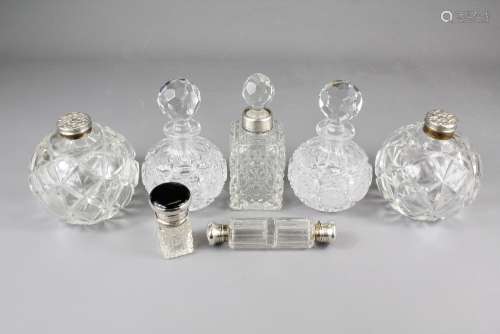 Various Scent Bottles, including a silver collared scent bottle, silver topped vanity jar, silver topped double scent bottle and a black enamel topped scent bottle