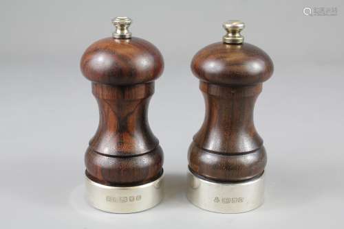 A Pair of Rosewood and Silver Salt and Pepper Mills, London hallmark, mm PG Ltd