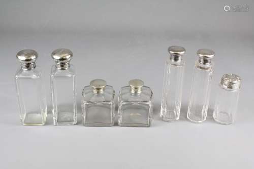 Six Silver Topped Cut-glass Vanity Jars, having various hallmarks