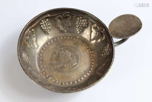 A Silver Quaich, London hallmark, dated 1925, mm D & G, the quaich embossed with fruit of the vine and set with a George II shilling, approx 90 gms