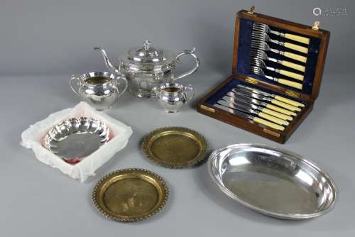 A Quantity of Silver Plate, known manufacturers including Sheffield Plate, the lot comprises Sheffield plate card tray, half pint mug, two wine goblets, two small brass pin dishes, a tea trio comprising teapot, jug and sugar bowl, fruit basket, boxed silver-plated dish, boxed fish knives and forks