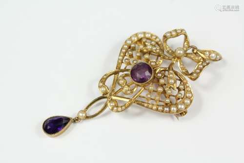 An Edwardian 15ct Gold Amethyst and Seed Pearl Brooch/Pendant, the pendant having central amethyst approx 7mm with a tear shaped drop approx 9 x 5mm, the brooch/pendant including loop approx 65 x 30mm, approx 7