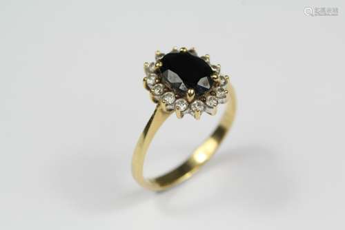 Lady's 18ct Gold Sapphire and Diamond Ring, the oval sapphire approx 8 x 6mm, surrounded by approx 28 pts of dias, size J+, approx 3