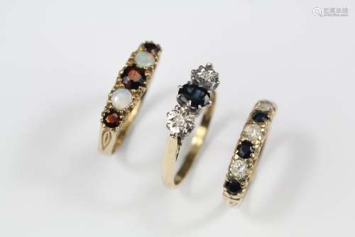 Three 9ct Gold Rings, including sapphire and diamond size Q, the oval sapphire approx 5 x 3 mm, Sapphire and Diamond Ring size M and an Opal and Garnet Ring size O, approx 7