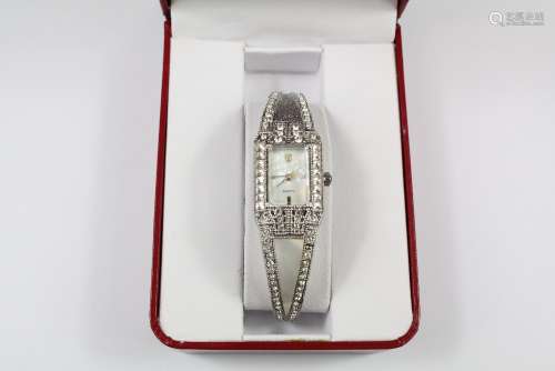 A Lady's Gucci Paolo by Wrist Watch, the watch having a mother of pearl face, with quarter baton dial, with Quartz movement, in the original box with warranty