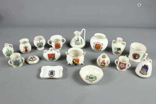 A Quantity of Goss Crested Ware, this lot comprises BBB (model of Elizabethan Quart Measure); Leeds Yorkshire Tyg, Cheltenham College (old Manx Pot), Folkestone (Abbots Cup); Bergen (Egyptian water jar); Ewer; Belfast (model of a Roman Salopian); Exeter (model of an old salt pot); West Riding of Yorkshire tyg, Dewsbury (Colchester vase); Scarborough (ancient bottle in Sunderland Museum); Derbyshire pot together with Ville des Paris tray; Carlton-ware Portland vase; Plymouth dish; Oriel vase by F