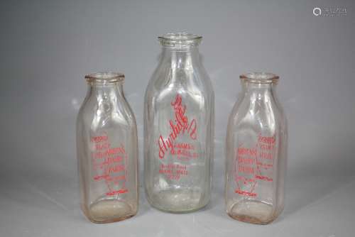 A Quantity of American Glass Milk Bottles, Ayrehill Farms Inc, two one quart and five half quart bottles