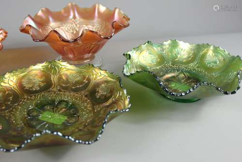 A Collection of Carnival Glass, including three orange lustre fluted bowls, jug, dessert dish, four green lustre bowls and a purple folded lustre-ware bowl