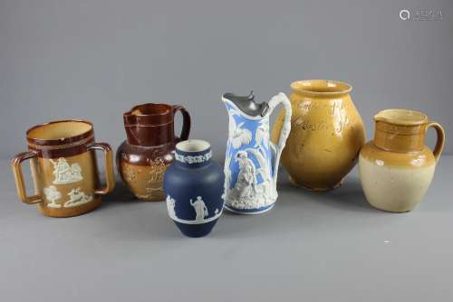 A Lambeth-ware Pottery Ale Jug; the jug approx 17 cms h, together with a vase with the inscription 