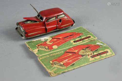 A Charming French made c1950's  Clockwork Tinplate 2002 Auto Miracle Toy Car, made by Joustra but distributed by Shackman & Co, USA, with opening door and bonnet